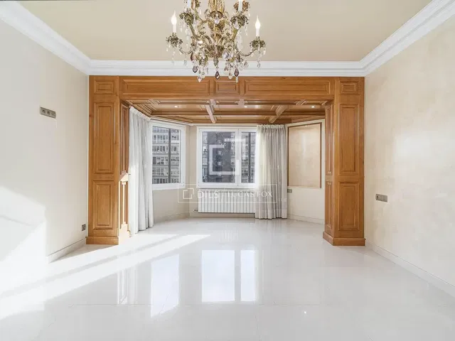 Living room; tile floor, high ceiling, wood beams, natural light, view