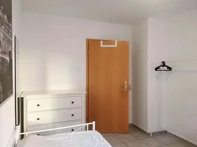 Bedroom; tile floor, natural light