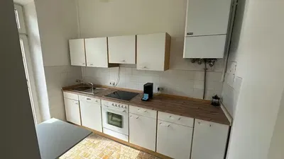 Kitchen; kitchen appliances, tile floor, natural light