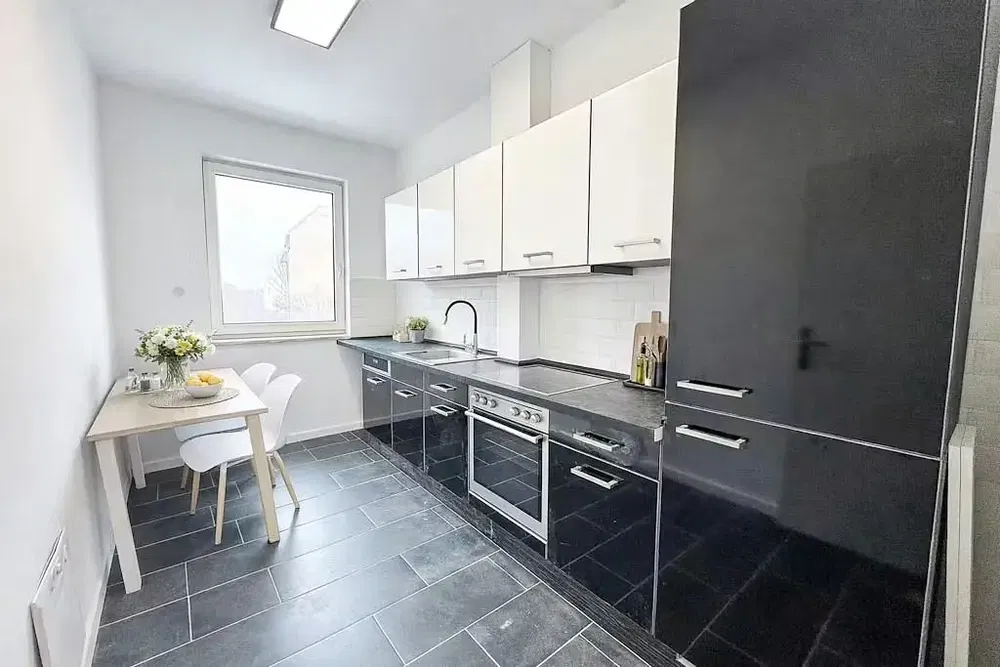 Kitchen; kitchen appliances, tile floor, natural light, modern style