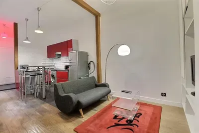 Living room; kitchen appliances, wood floor, natural light, modern style