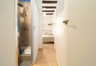 Bathroom; wood beams, wood floor, natural light