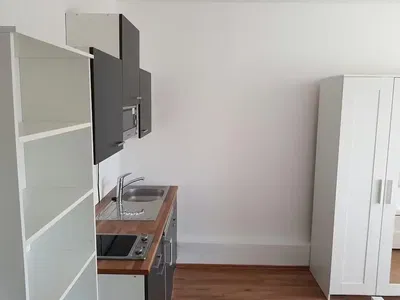 Kitchen; kitchen appliances, wood floor, renovated, natural light