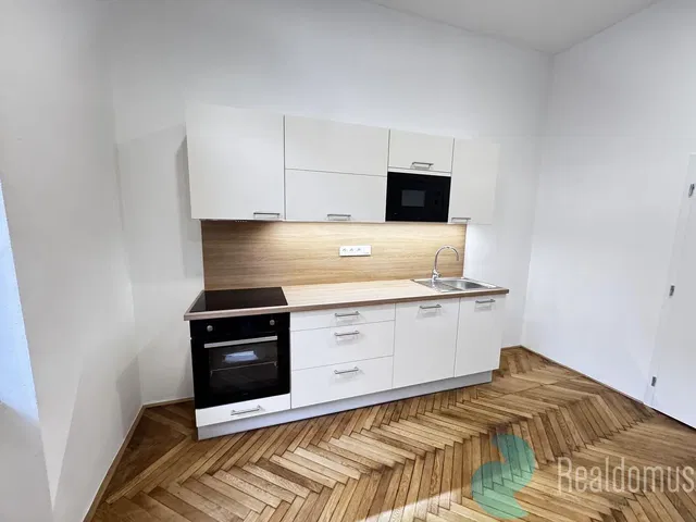Kitchen; kitchen appliances, wood floor, renovated, natural light, modern style