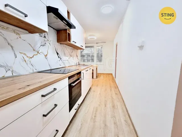 Kitchen; kitchen appliances, wood floor, renovated, natural light