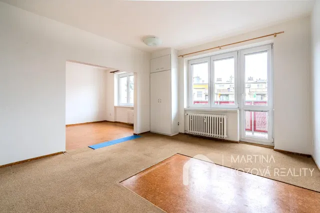 Living room; natural light, needs renovation, tile floor