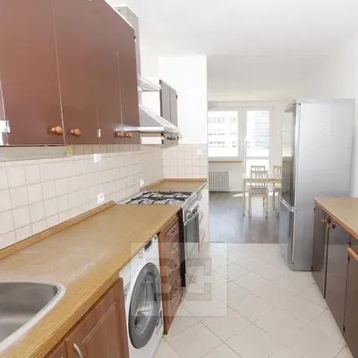 Kitchen; kitchen appliances, tile floor, natural light