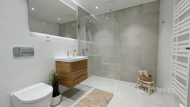 Bathroom; tile floor, renovated, natural light, modern style