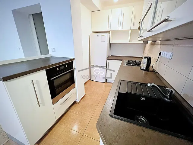 Kitchen; kitchen appliances, tile floor, renovated, natural light, modern style