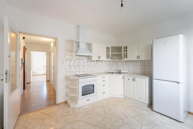 Kitchen; kitchen appliances, tile floor, natural light