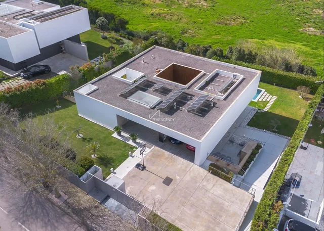 House and surroundings; view