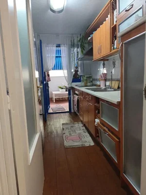 Kitchen; kitchen appliances, wood floor, natural light, modern style