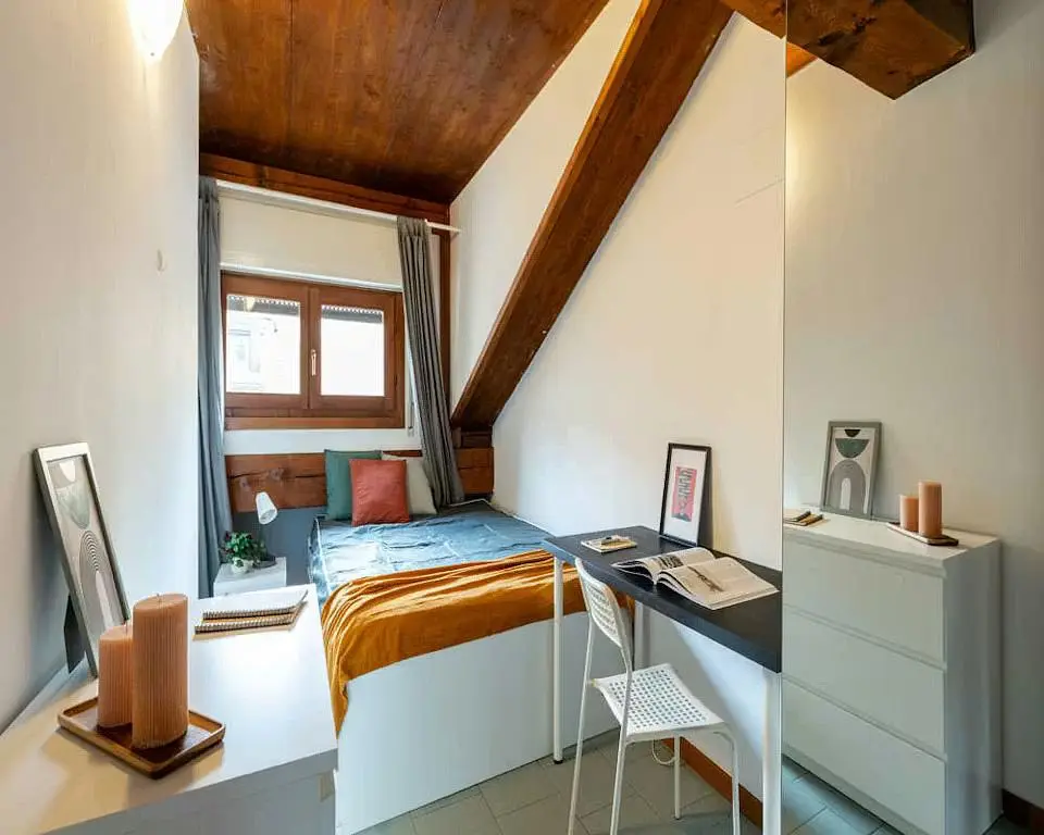 Bedroom; natural light, wood beams, tile floor