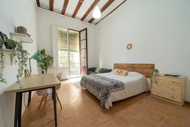 Bedroom; natural light, wood beams, modern style