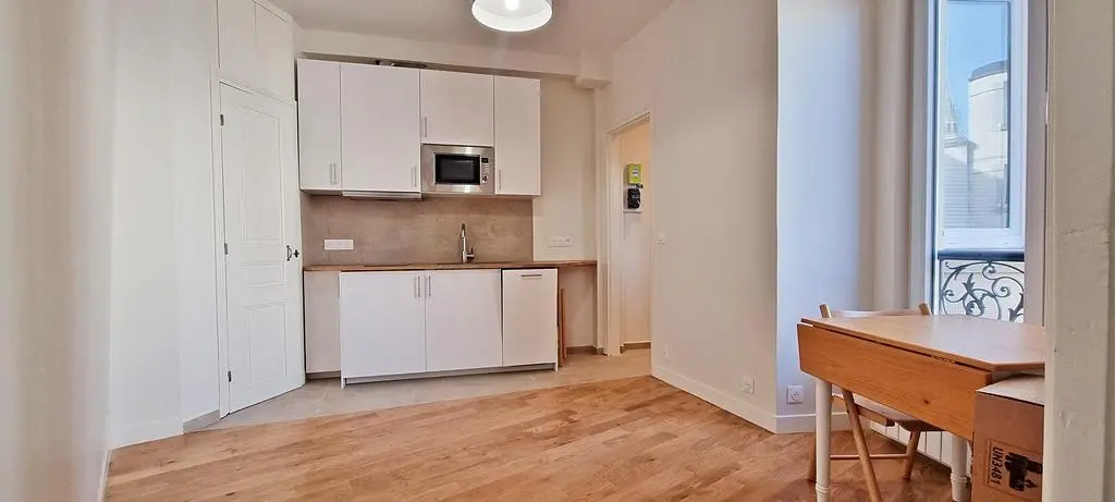 Kitchen; kitchen appliances, wood floor, natural light, modern style