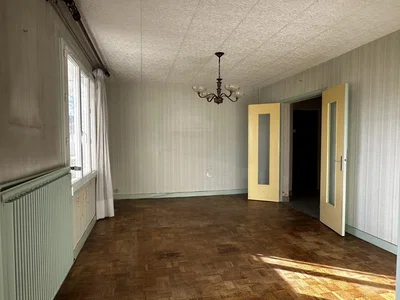 Living room; natural light, needs renovation