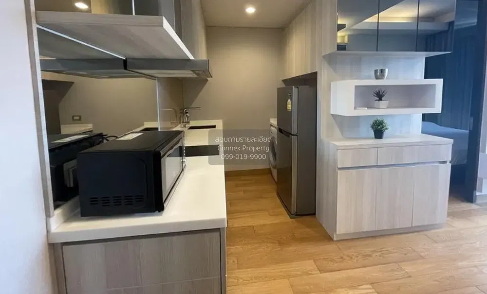 Kitchen; kitchen appliances, wood floor, natural light