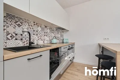 Kitchen; kitchen appliances, wood floor, renovated, natural light, modern style