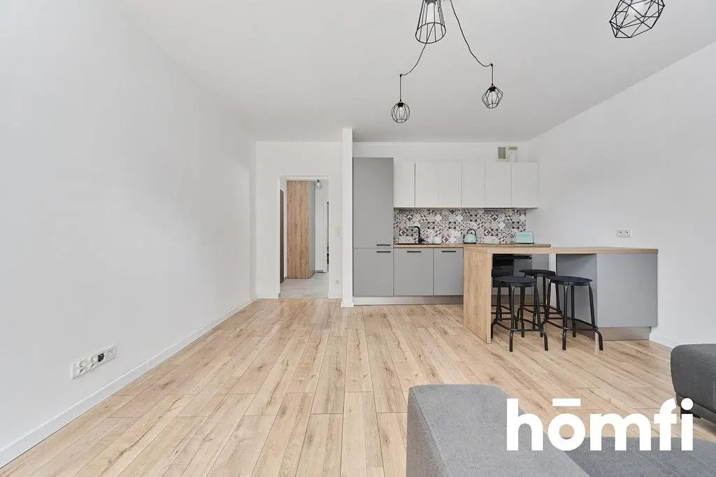 Living room; wood floor, modern style, natural light, kitchen appliances