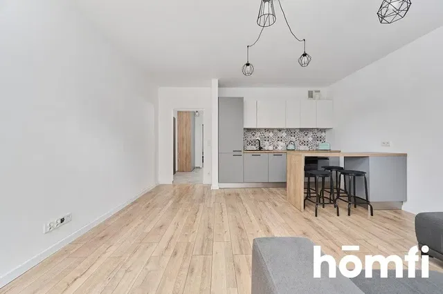 Living room; wood floor, modern style, natural light, kitchen appliances