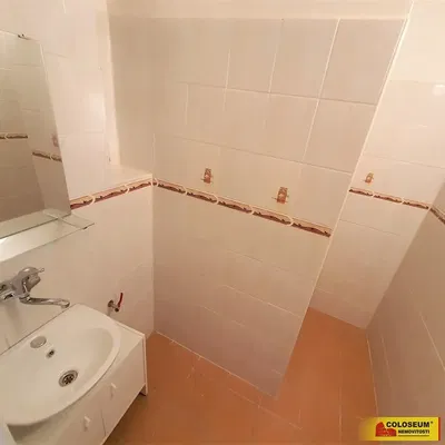 Toilet; tile floor, needs renovation