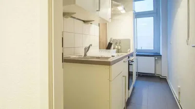 Kitchen; kitchen appliances, tile floor, natural light, modern style