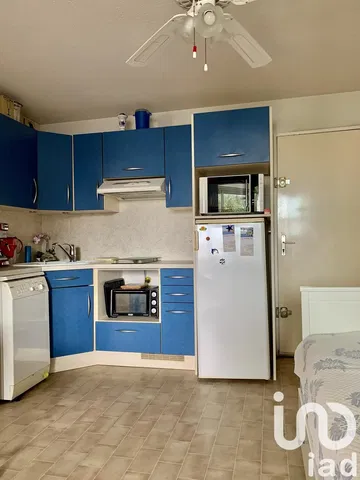 Kitchen; kitchen appliances, tile floor, natural light