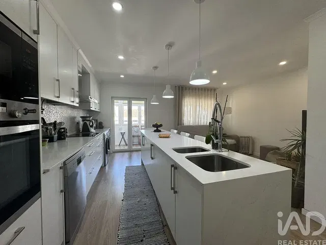 Kitchen; kitchen appliances, natural light, modern style, wood floor