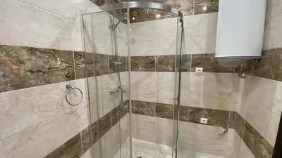 Bathroom; tile floor, water heater, natural light