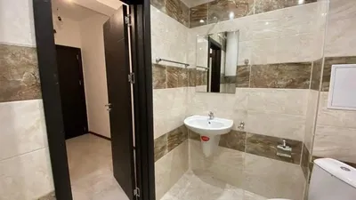 Toilet; tile floor, natural light