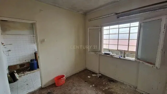 Kitchen; needs renovation, tile floor