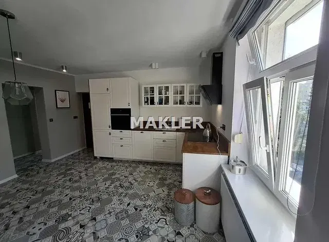 Kitchen; kitchen appliances, tile floor, natural light