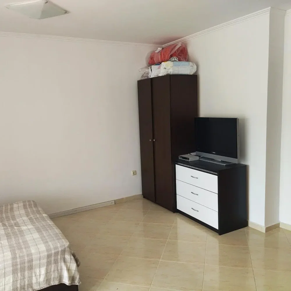 Bedroom; tile floor, natural light