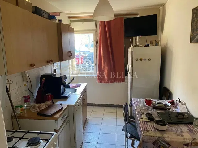 Kitchen; kitchen appliances, tile floor, needs renovation