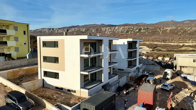 House and surroundings; view