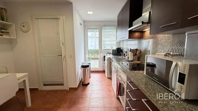 Kitchen; kitchen appliances, tile floor, natural light