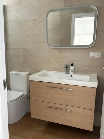 Toilet; tile floor, wood floor, renovated, natural light