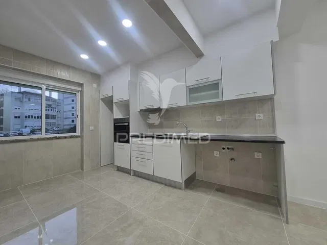 Kitchen; kitchen appliances, tile floor, view, renovated, natural light