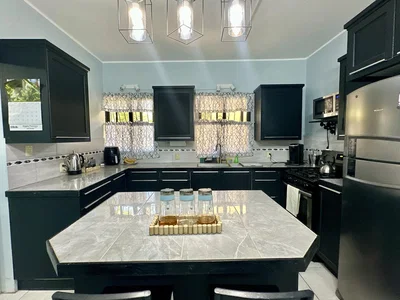 Kitchen; kitchen appliances, tile floor, natural light, modern style