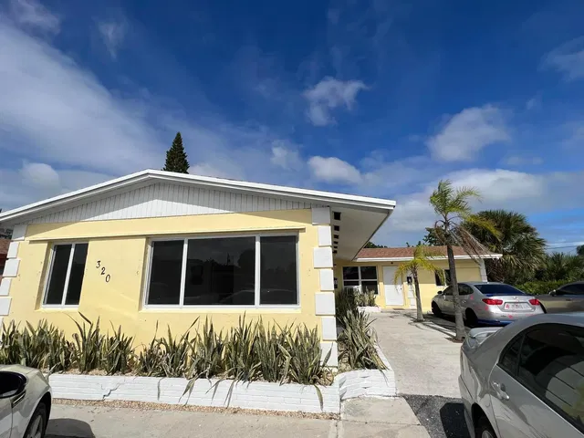 House and surroundings; view