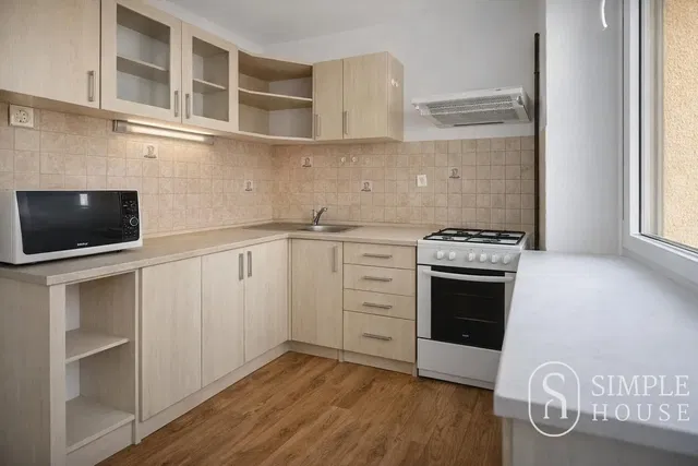 Kitchen; kitchen appliances, tile floor, renovated, natural light, modern style