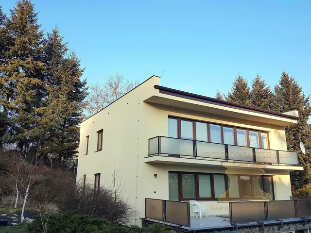 House and surroundings; view