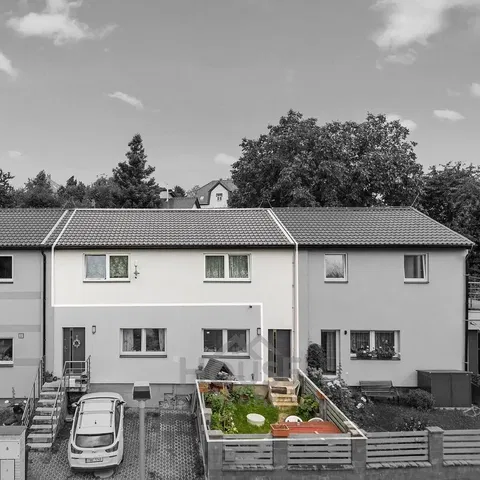 House and surroundings; view