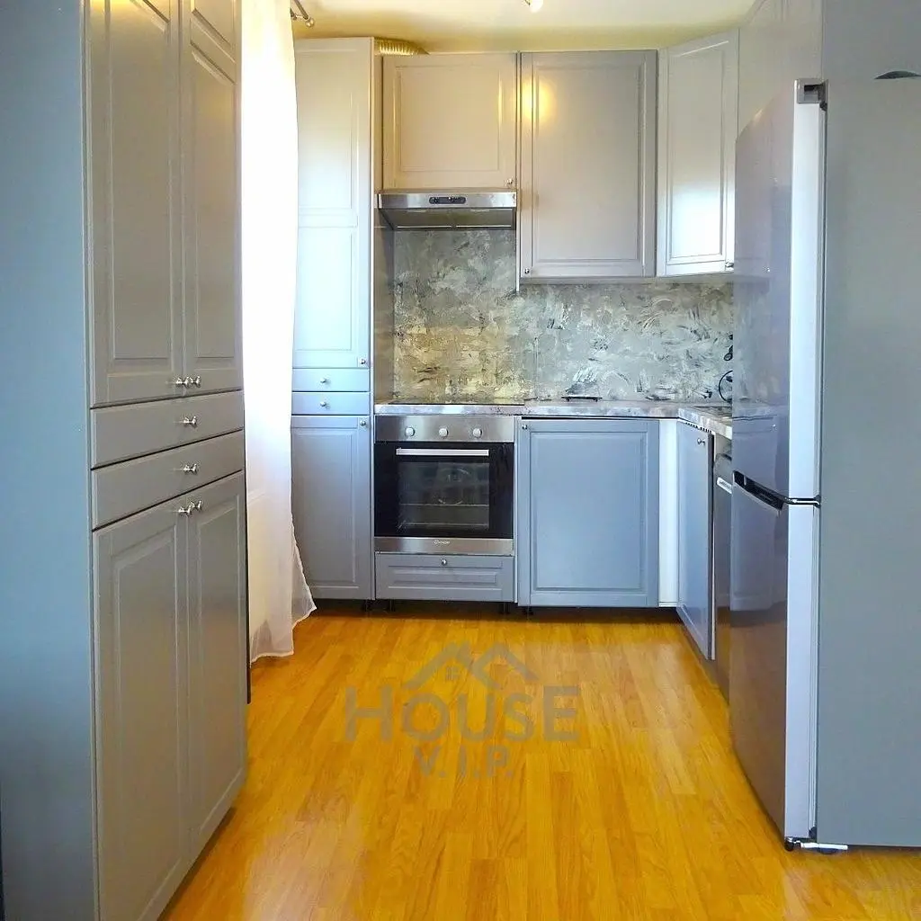 Kitchen; kitchen appliances, wood floor, renovated, natural light