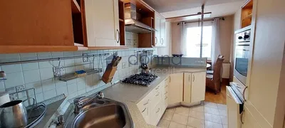 Kitchen; kitchen appliances, tile floor, natural light