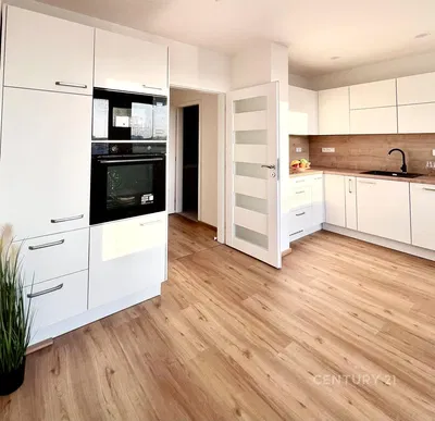 Kitchen; kitchen appliances, wood floor, renovated, natural light