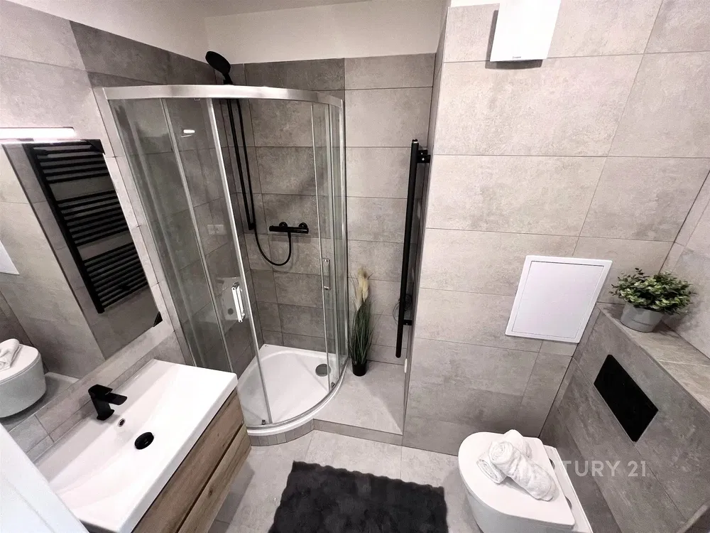Bathroom; tile floor, renovated, natural light, modern style