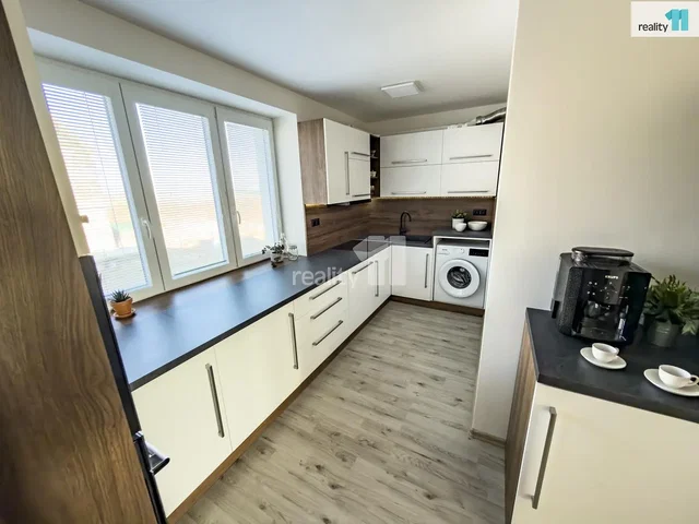 Kitchen; kitchen appliances, wood floor, natural light, modern style