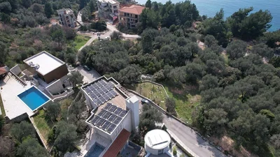 House and surroundings; view