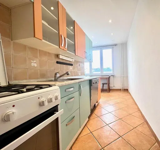 Kitchen; kitchen appliances, tile floor, natural light